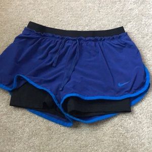 Blue and black Nike Dri-Fit shorts